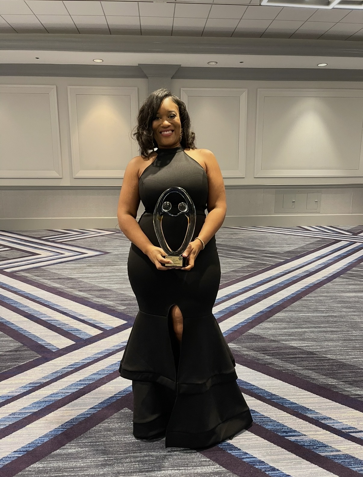 Kelli Turner accepting a leadership recognition award